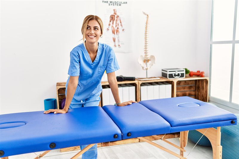 Licensed massage therapist providing bodywork at Aches Away